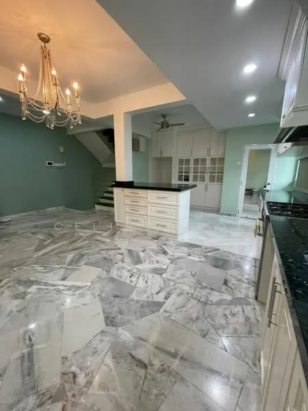 Kitchen features: marble flooring, green painted walls, chandelier light fixture, ceiling fan, white cabinetry, black countertop, open layout, stainless-steel appliances, built-in cabinets, island with storage; style: modern.