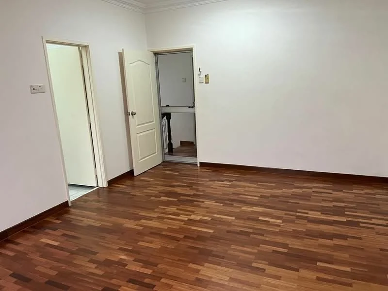 Room features: wooden flooring, white painted walls, door leading to another room, door leading to hallway, crown moulding, natural light from doorways.