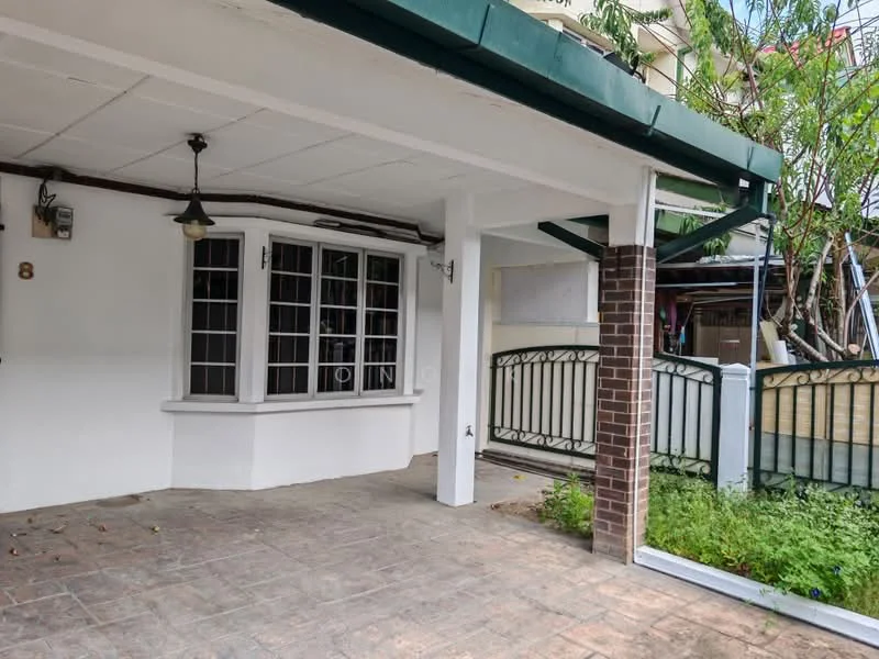 Exterior type: linked terrace house; features: covered porch, brick columns, white painted facade, sliding gate, manicured garden, tile flooring, overhead pendant light, large windows, greenery adjacent to the porch; style: modern.