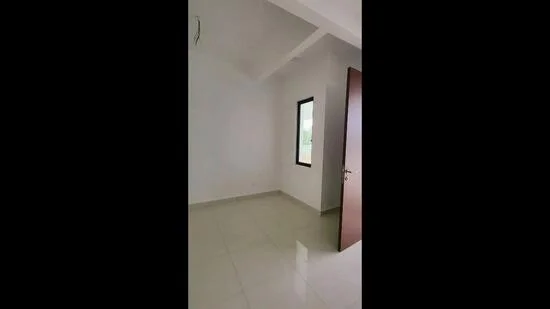 Room features: white painted walls, sliding door, tile flooring, single window, high ceiling, neutral color scheme.
