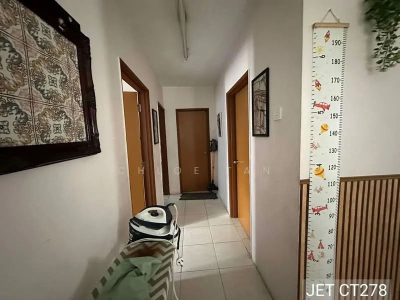 Hallway features: white painted walls, tile flooring, wooden doors, framed artwork on walls, decorative height chart, light fixture on ceiling, doorway leading to other rooms.