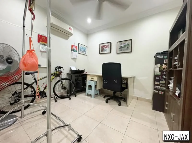 Study features: cream painted walls, tile flooring, ceiling fan, wall-mounted air conditioning unit, desk with chair, bicycle, freestanding shelving unit, framed artwork on walls, metal filing cabinet, calendar on wall.