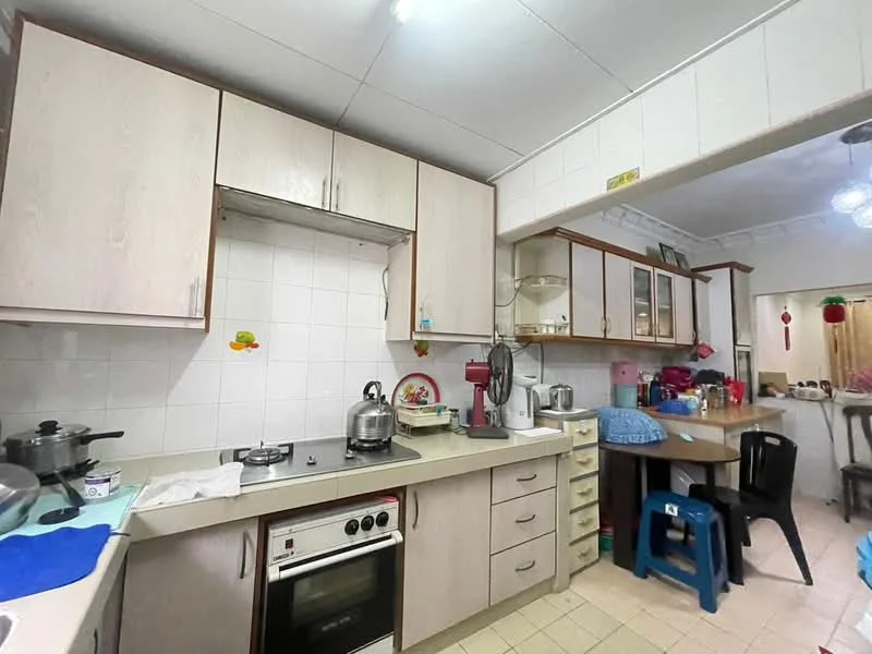Kitchen features: light wood cabinetry, white tiled backsplash, grey countertop, stainless-steel gas stove, built-in oven, kettle, blender, microwave, sink, dish rack, dining table with chairs, floor tiles, refrigerator; style: modern.