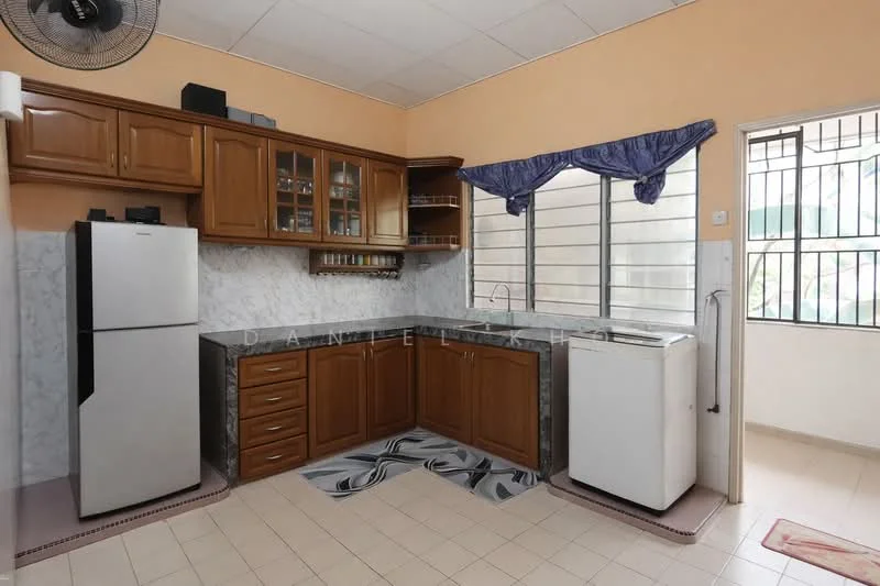 Kitchen features: brown wooden cabinetry, black granite countertop, stainless-steel fridge, white washing machine, white tiled backsplash, cream tiled flooring, single-bowl stainless-steel sink, window with blue curtain treatment, ceiling fan, open shelving, kitchen cabinet with glass doors; style: traditional.
