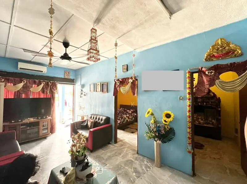 Living features: blue painted walls, white ceiling, 5-blade ceiling fan, wall-mounted TV, black leather 3-seater sofa, wooden coffee table, decorative wall art, curtains with valance, marble tile flooring, potted sunflowers, decorative wall shelf, door leading to balcony; style: traditional; view: garden. Bedroom features: brown patterned bedding, wooden bed frame, decorative wall hanging; style: traditional.