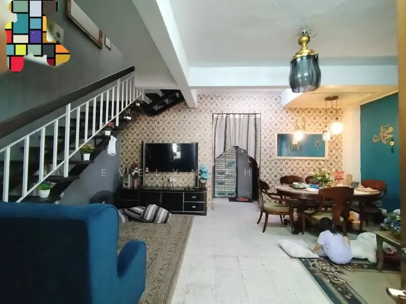 Living features: blue fabric sofa, area rug with geometric pattern, wall-mounted TV, TV console, decorative wall with floral wallpaper, white painted walls, ceiling light fixture, staircase with wooden railing, potted plants, open-plan layout to dining area; style: modern. Dining features: wooden dining table, upholstered dining chairs, decorative wall with blue paint, pendant lighting, framed artwork, potted plants; style: modern.