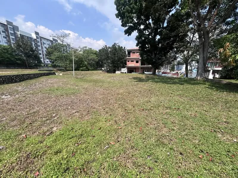 Exterior type: landscape garden; features: manicured lawn, mature trees, surrounding greenery, open grassy area, adjacent buildings, clear blue sky; style: modern.