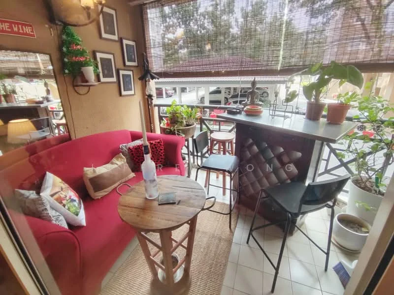 Room features: red fabric sofa, wooden coffee table, decorative cushions, bar counter with high stools, potted plants, window blinds, framed artwork on walls, woven area rug, glass bottle on table; style: contemporary; view: street.