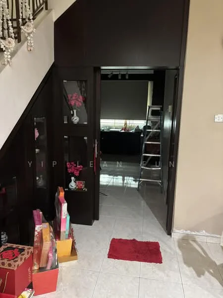 Room features: white tiled flooring, dark wooden door, dark wooden cabinetry, staircase with wooden railing, decorative wall paneling, red area rug, decorative items on floor, window with blinds; style: modern.