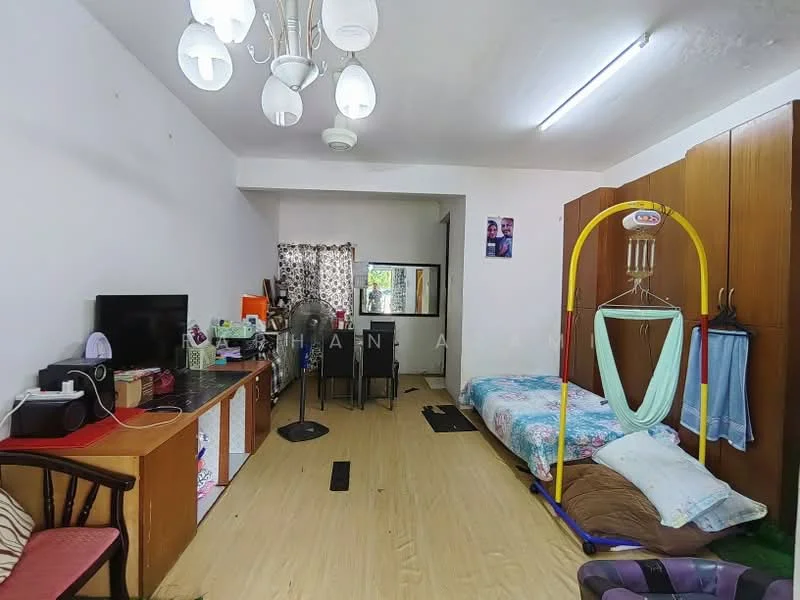 Room features: laminate flooring, white painted walls, ceiling light fixture with multiple bulbs, wall-mounted TV, wooden desk, black chair, window with sheer curtains, double bed with colorful bedding, hammock stand, built-in wardrobe, fan, decorative wall art; style: modern.