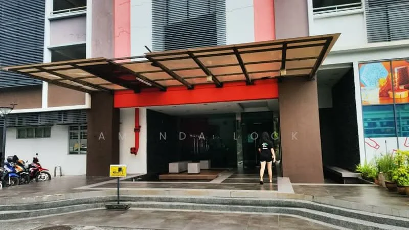 Exterior type: mid-rise condominium; features: glass entrance doors, covered entrance with awning, red accent wall, brown painted facade, concrete flooring, landscaped planters, visible parking area, bicycle parking, security signage, modern architectural design; style: modern.