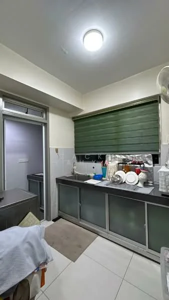Kitchen features: grey countertop, stainless-steel sink, chrome faucet, glass-front lower cabinets, white upper cabinets, tile backsplash, white walls, tile flooring, overhead fluorescent lighting, window with green blinds, kitchen appliances visible, various dishes and utensils on countertop. Room features: doorway leading to another room, grey walls.