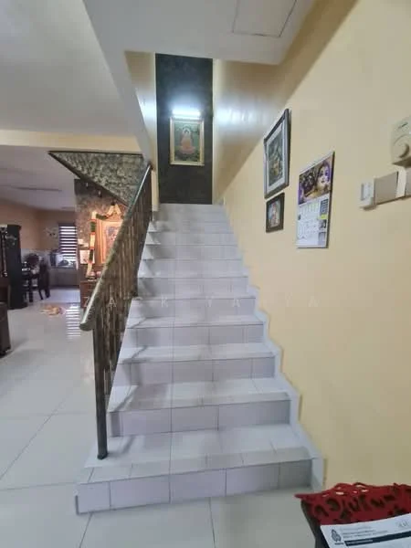 Room features: staircase with white tiled steps, metal railing, yellow painted walls, framed artwork on wall, wall-mounted calendar, decorative wall with patterned wallpaper, floor tiles in light color, light fixture on ceiling; style: contemporary.