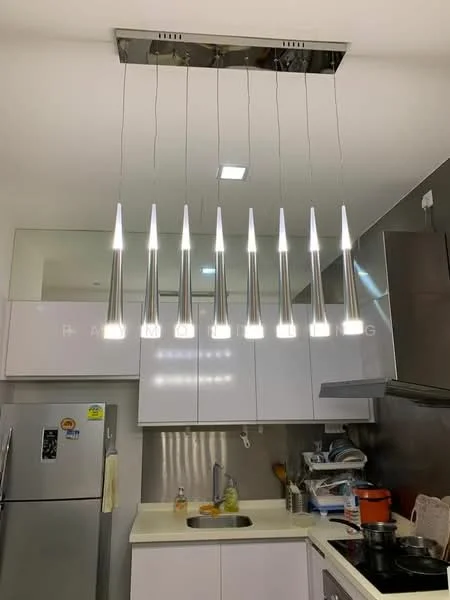 Kitchen features: modern pendant lighting with multiple fixtures, stainless-steel refrigerator, white cabinetry, light-colored countertop, stainless-steel sink, chrome faucet, backsplash with metallic finish, built-in stove, kitchen utensils visible; style: modern.