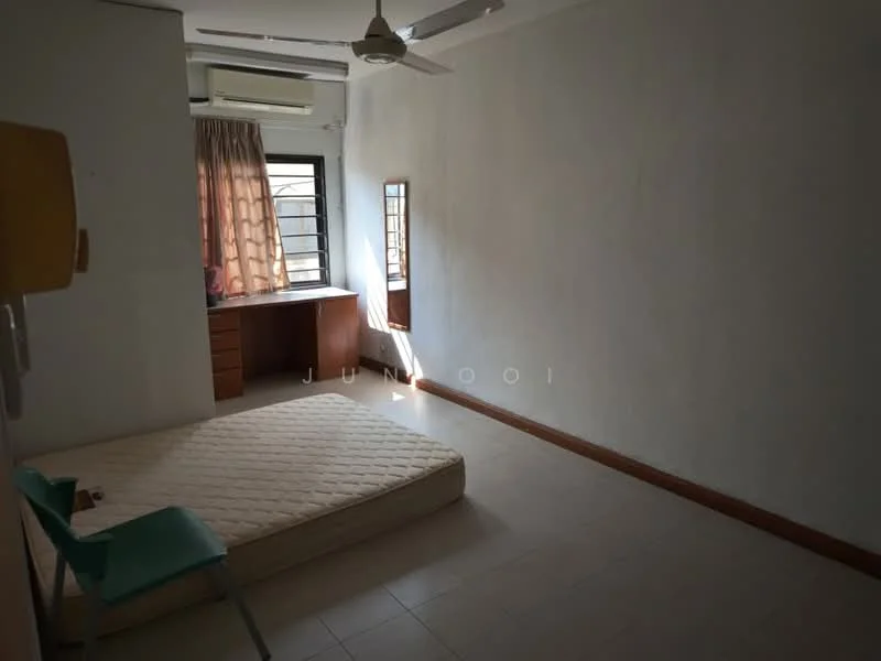 Bedroom features: white painted walls, tile flooring, ceiling fan, window with grille, curtains, built-in desk, wooden cabinetry, unmade mattress on the floor, green chair.