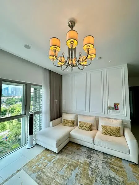 Living features: white sectional sofa, decorative cushions in gold, chandelier with yellow shades, large window with city view, curtains in light grey, white painted walls with paneling, area rug with abstract pattern, floor-to-ceiling windows, wall-mounted air conditioning unit, recessed ceiling lights; style: modern; view: city.