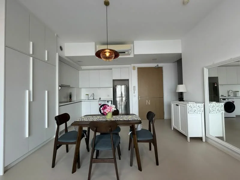 Dining features: 6-seater dining table, wooden dining chairs, pendant light fixture, white cabinetry, stainless-steel fridge, built-in oven, ceramic cooktop, white countertops, open shelving, floor-to-ceiling cabinets, washer-dryer combo, mirror with decorative frame; style: modern. Kitchen features: white cabinetry, stainless-steel fridge, built-in oven, ceramic cooktop, white countertops, open shelving, floor-to-ceiling cabinets; style: modern.