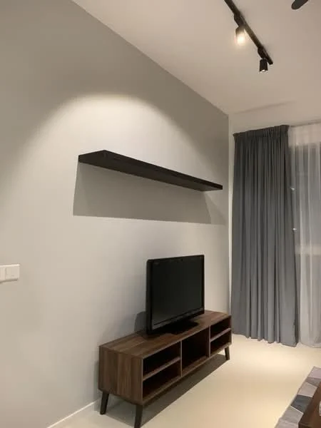 Living features: grey painted walls, white ceiling, recessed downlights, wooden TV console, black flat-screen TV, floating shelf, floor-to-ceiling windows, sheer curtains, light-colored flooring; style: modern.