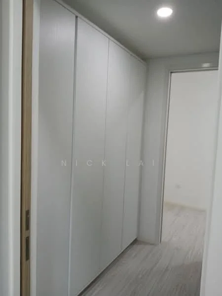Room features: white painted walls, built-in wardrobe with sliding doors, light wood flooring, recessed downlights, neutral color scheme, doorway leading to another room; style: modern.
