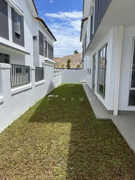 Exterior type: linked terrace house; features: white painted facade, manicured lawn, side walkway, fenced boundary, two-storey structure, clear blue sky, mountain view in background; style: modern.