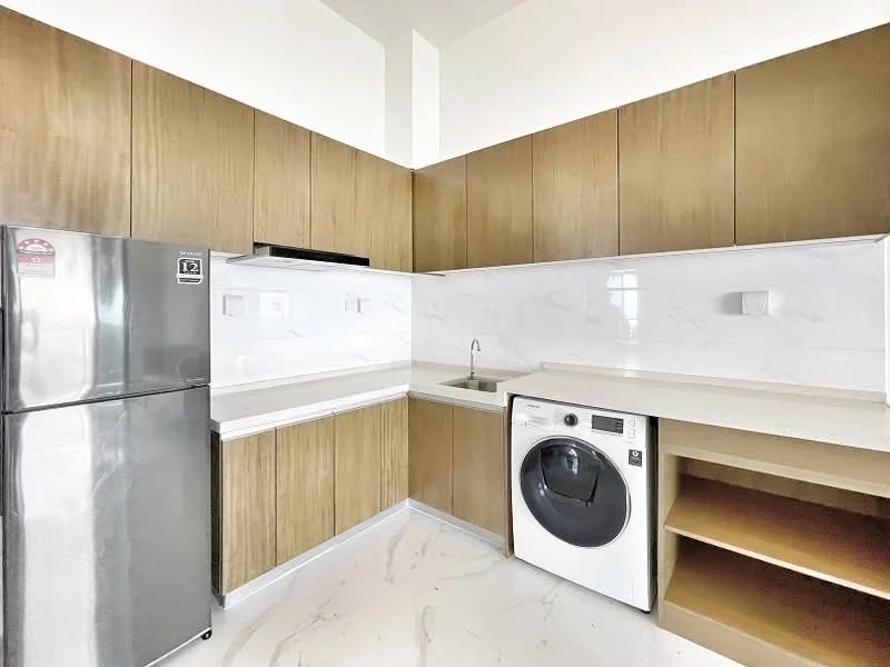 Kitchen features: stainless-steel fridge, built-in oven, single-bowl stainless-steel sink, chrome pull-down faucet, white washing machine, laminate cabinetry in wood finish, white marble backsplash, countertop with integrated sink, open shelving, marble tile flooring; style: modern.