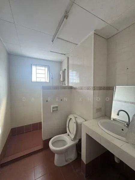 Bathroom features: white tiled walls, pink tiled flooring, single-sink vanity with wall-mounted faucet, framed mirror, one-piece toilet, window for natural light, shower area with wall-mounted showerhead, built-in storage shelf.