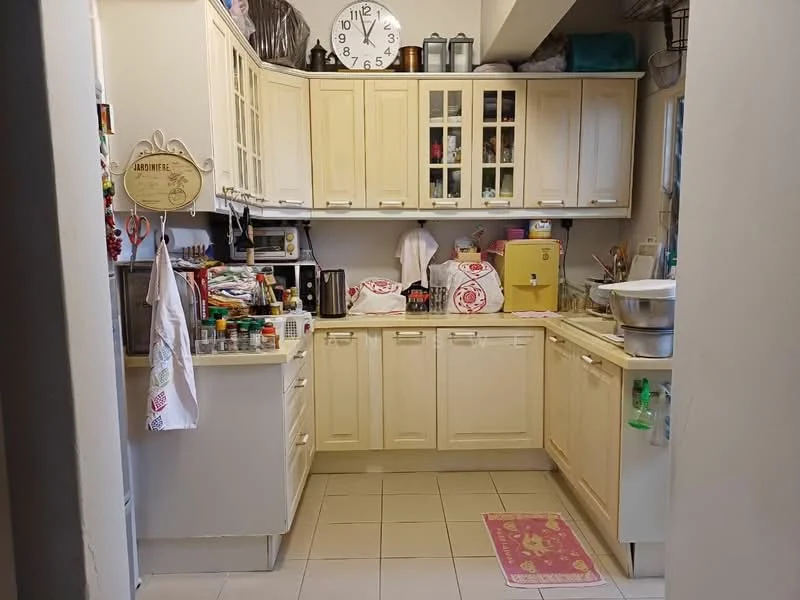 Kitchen features: cream cabinetry, glass-front upper cabinets, countertop with sink, single-bowl stainless-steel sink, chrome pull-down faucet, built-in oven, microwave, toaster, kettle, stainless-steel mixing bowl, tile backsplash, white tiled flooring, wall clock, area rug with pink pattern.