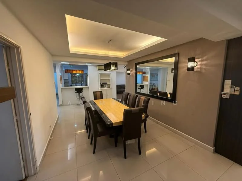 Dining features: 8-seater dining table with wooden top, upholstered dining chairs in brown, recessed ceiling with LED lighting, mirrored wall, wall sconces, white painted walls, glossy tile flooring, open layout to kitchen, kitchen island visible in background; style: modern.
