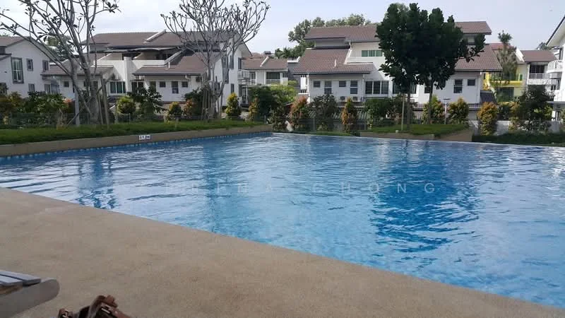 Exterior type: swimming pool deck; features: infinity pool, surrounded by landscaped gardens, manicured lawn, tropical trees, residential buildings in background, pool deck with concrete surface; style: modern.