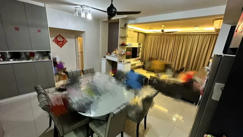 Dining features: round dining table, upholstered dining chairs, 5-blade ceiling fan, recessed downlights, cream painted walls, white cabinetry, grey tiled flooring, curtains, built-in shelving unit, decorative items on shelves; style: modern. Kitchen features: grey cabinetry, stainless-steel fridge, built-in oven, ceramic cooktop, kitchen island, open shelving, white countertops; style: modern.