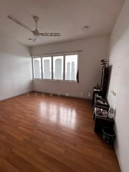 Room features: wooden flooring, white painted walls, ceiling fan, three windows with mesh grills, wall-mounted TV console, decorative items on console, waste bin, natural light from windows.