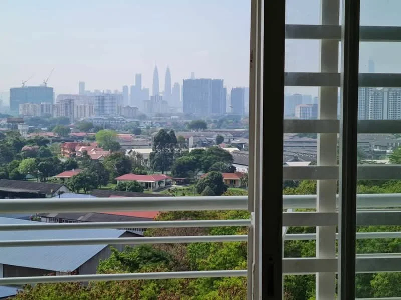 Room features: floor-to-ceiling windows, sliding glass door, city skyline view, greenery visible outside, window treatments with horizontal slats; view: city.