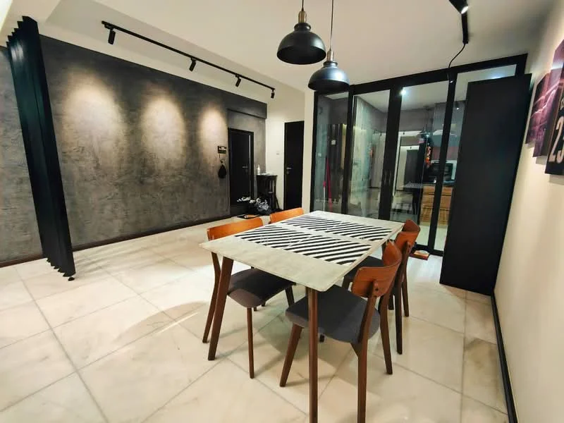 Dining features: rectangular dining table with grey top, 4 wooden dining chairs with upholstered seats, white marble flooring, grey accent wall, track lighting, pendant lights above table, glass wall partition, dark wooden door, decorative wall art, open space layout; style: modern.