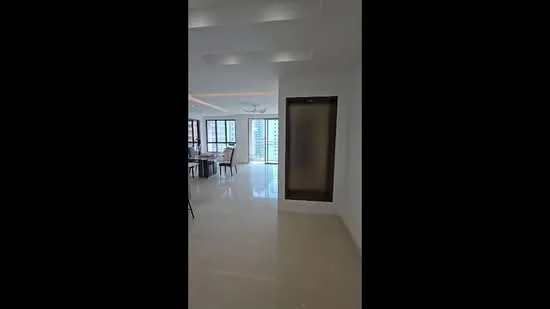 Room features: white painted walls, recessed ceiling lights, marble tile flooring, large windows with city view, open layout, dining area visible in background, ceiling fan, neutral color palette; style: modern; view: city.
