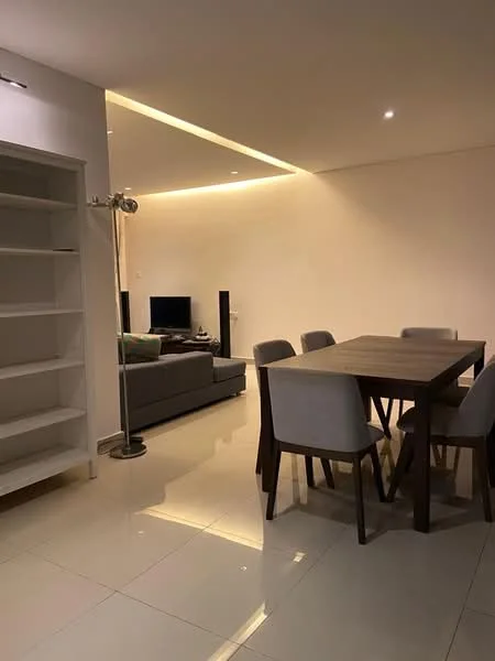 Dining features: 6-seater dining table, upholstered dining chairs, polished ceramic tile flooring, recessed LED downlights, white painted walls, built-in shelving unit, floor-to-ceiling windows, sofa in living area visible in background, TV console in living area visible in background; style: modern.