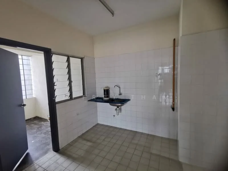 Room features: white tiled walls, grey tiled flooring, single-bowl stainless-steel sink, chrome faucet, window with metal grilles, light fixture on ceiling, countertop with blue surface, open space layout.