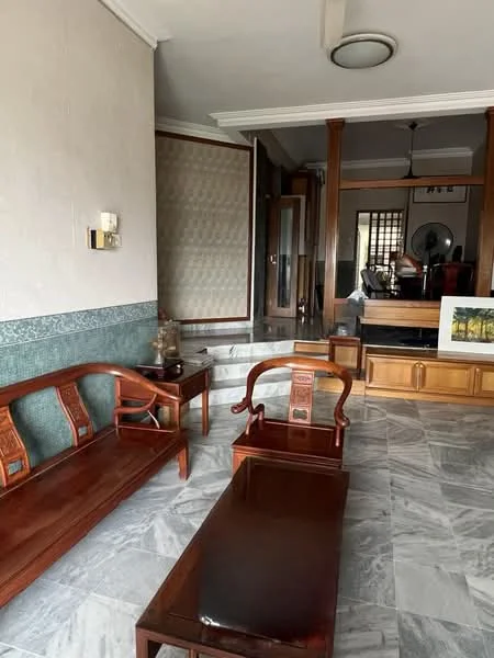 Living features: marble flooring, white painted walls, wooden coffee table, wooden sofa set, wall-mounted light fixture, decorative wall panel, ceiling fan, open layout to adjacent room; style: traditional.