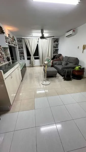 Living features: grey fabric sectional sofa, white wall-mounted shelves, floor-to-ceiling windows with sheer curtains, white tiled flooring, ceiling fan, wall-mounted air conditioning unit, decorative items on shelves, standing fan, black coffee table, green potted plant; style: modern.