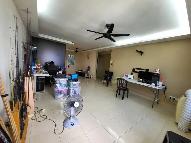 Living features: cream painted walls, white ceiling with recessed lighting, tiled flooring, 5-blade ceiling fan, wall-mounted TV, computer desk with chair, black plastic chair, multiple storage boxes, fishing rods mounted on the wall, floor fan.