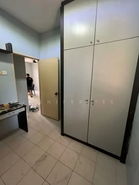 Room features: light blue painted walls, white tiled flooring, built-in wardrobe with sliding doors, desk with storage, door leading to another room.