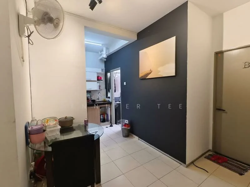 Room features: white painted walls, grey accent wall, tile flooring, ceiling fan, glass dining table, black dining chairs, open kitchen area visible, doorway to kitchen, kitchen appliances visible in background; style: modern.