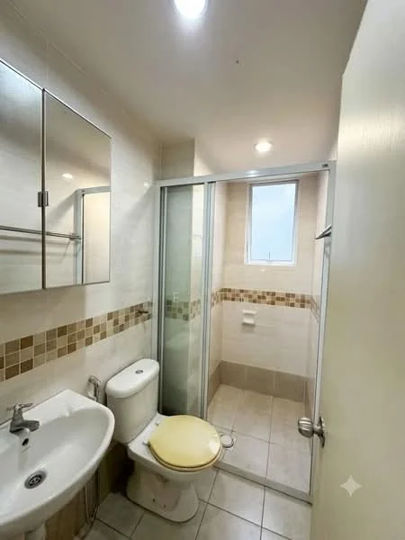 Bathroom features: single-sink vanity with mirror, chrome basin mixer faucet, toilet, walk-in shower with glass enclosure, tile cladding on walls, ceramic tile flooring, window for natural light, towel rack, decorative tile border, light fixture; style: modern.