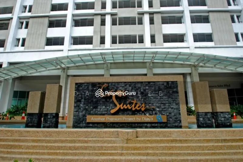 Exterior type: mid-rise condominium; features: glass curtain wall, stone cladding, water feature at entrance, landscaped garden, covered entrance, signage with project name, paved walkway, planters with greenery; style: modern.
