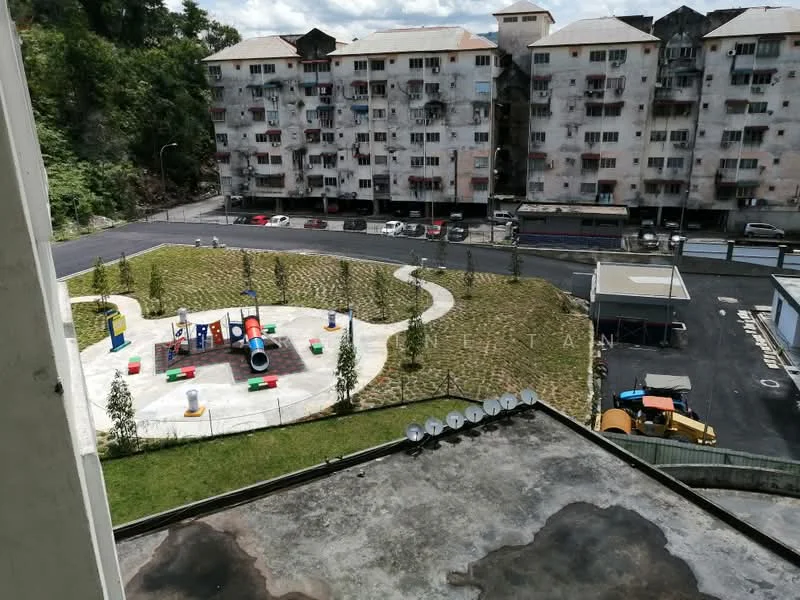 Exterior type: low-rise apartment block; features: playground with colorful equipment, manicured lawn, paved walkway, parking area, multiple-storey residential building, surrounding greenery; style: modern.