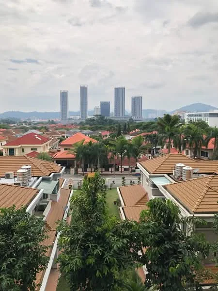 Exterior type: linked terrace house; features: red tiled roof, manicured lawn, palm trees, surrounded by greenery, city skyline in background, multiple-storey buildings in distance; style: modern.