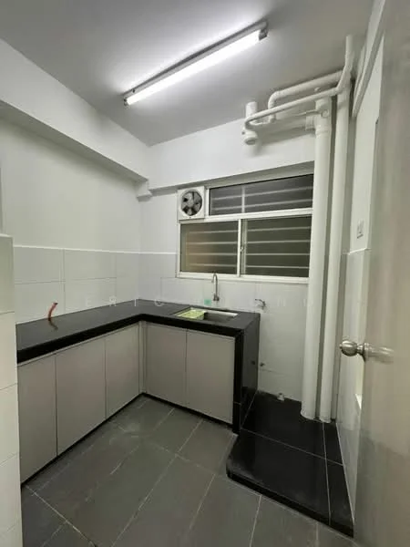 Kitchen features: L-shaped kitchen layout, black granite countertop, grey cabinetry with flat-panel doors, single-bowl stainless-steel sink, chrome pull-down faucet, white tiled walls, grey tiled flooring, window with metal grille, exposed plumbing pipes, fluorescent ceiling lights; style: modern.