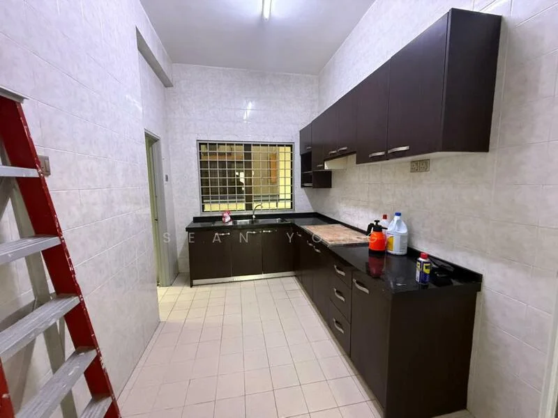 Kitchen features: dark wood cabinetry, black granite countertop, single-bowl stainless-steel sink, chrome pull-down faucet, tile backsplash, ceramic tile flooring, window with security grille, built-in oven, freestanding range oven, recessed ceiling lights, wall-mounted shelves, cleaning supplies on countertop, ladder in the corner; style: modern.