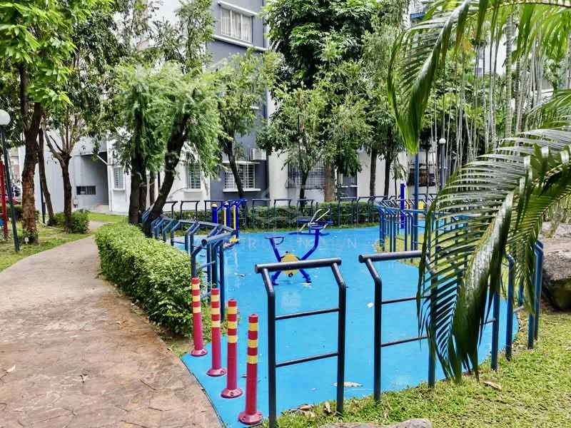 Exterior type: landscape garden; features: blue water play area, surrounding greenery, manicured lawn, pathway with stone paving, decorative light poles, playground equipment, tropical landscaping, trees providing shade; style: modern.