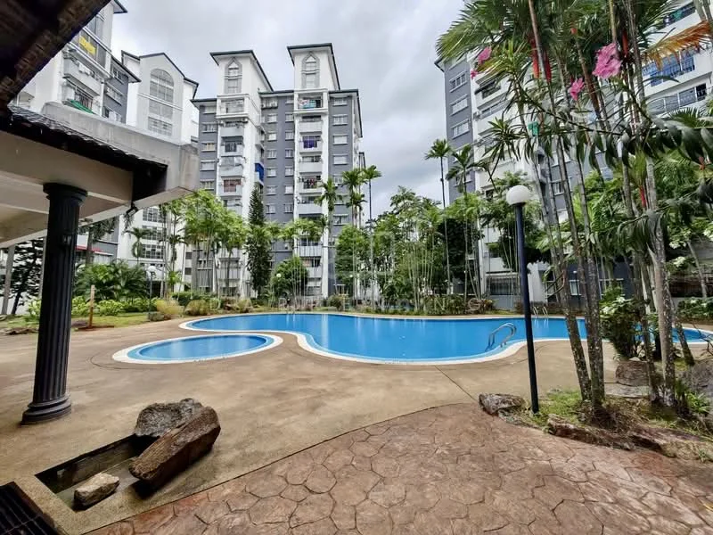 Exterior type: mid-rise condominium; features: swimming pool with curved edges, pool deck with loungers, landscaped garden with tropical plants, paved walkway, surrounded by greenery, multiple-storey residential building, balconies visible on upper floors, outdoor lighting fixtures; style: modern.