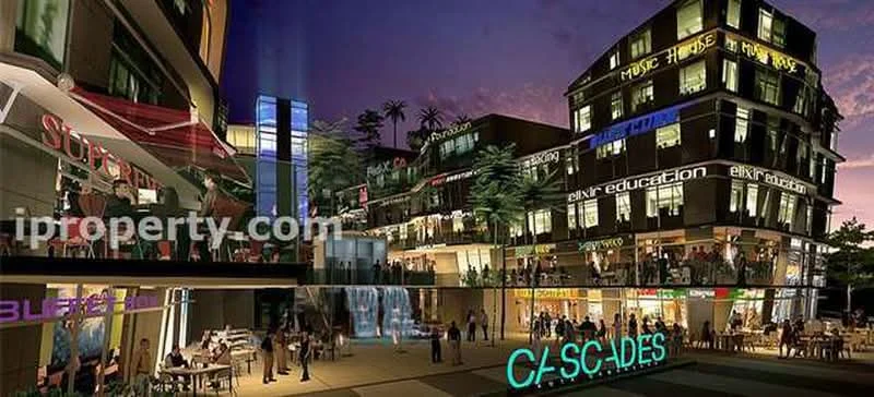 Exterior type: mixed-use development; features: multi-storey building, outdoor dining area, water feature with waterfall, illuminated signage, glass facade, balconies on upper floors, palm trees in landscaping, pedestrian walkways, restaurant and retail spaces, nighttime lighting, open-air seating, modern architectural design; style: contemporary.